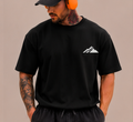 ASCEND Oversized Performance Tee in black, front, official ASCEND mountain mark on left chest